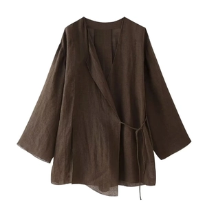 Detailed view of the dark brown side-tie long sleeve top showing retro linen texture
