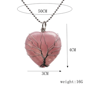 Detail of rose quartz heart pendant with copper tree of life wire wrap on 50cm bead chain