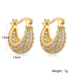 Detailed view of U-shaped gold earrings with pavé zircons measuring 1.8cm by 1.6cm