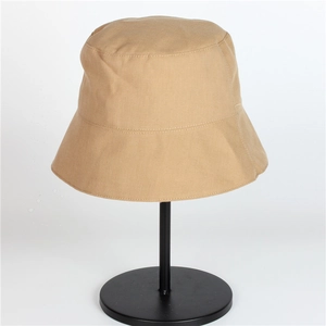Detail view of khaki UV sun hat showing durable canvas texture and stitching on metal stand