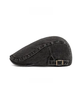 Side view of dark gray washed denim ivy cap with adjustable metal buckle detail