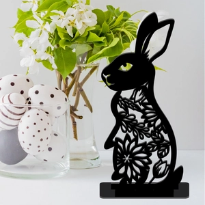 Detailed view of a black acrylic Easter bunny table ornament with hollow flower patterns