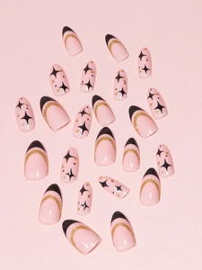 French tip press-on nails with black stars and golden glitter moon on pink base