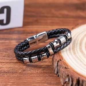 Men's double-layered black braided leather bracelet with silver rings on wood section