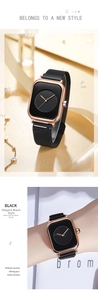 Close-up of minimalist black dial with rose gold square case and black mesh watch band