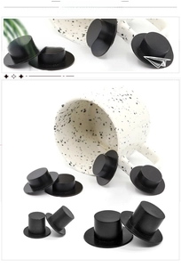 Detail showing multiple sizes of matte black plastic mini top hats for DIY doll crafts
