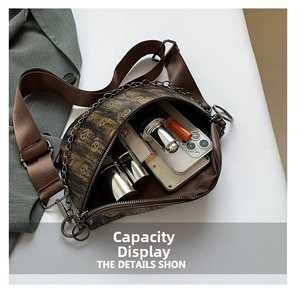 Detail of vintage skull print fanny pack showing interior capacity for phone and cosmetics