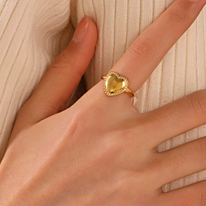 Minimalist 18K gold plated heart ring with delicate beaded texture on female hand