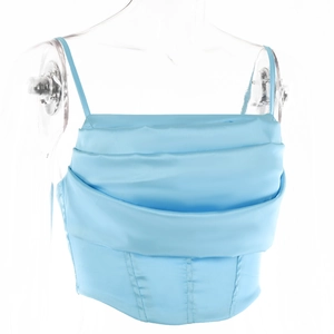 Detailed close-up of light blue satin cowl neck top with corset style draped fabric