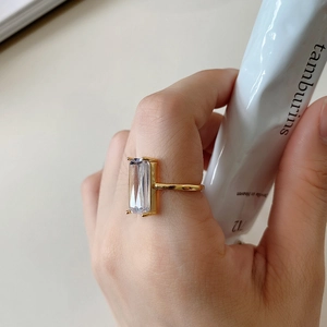 Detail of a 925 silver gold ring featuring a large emerald-cut rectangular zircon stone