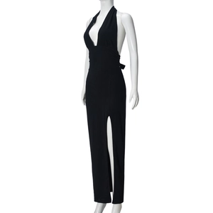 Detail of black halter maxi dress showing the high side slit and backless silhouette