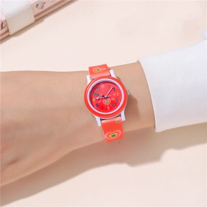 Close-up of children's quartz watch with colorful rainbow heart silicone strap