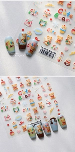 Close-up of Christmas bear nail art stickers with hand-drawn holiday patterns and decals