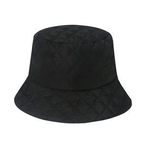 Detail of black quilted puffer bucket hat with elegant diamond lattice stitching pattern