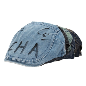 Vintage washed denim ivy cap featuring graffiti letters and a retro street style design