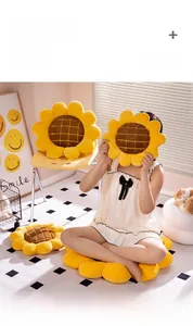 Detailed view of sunflower plush cushion showing corduroy petals and checkered core