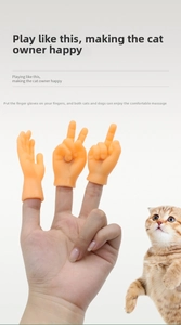 Close-up of human hand wearing tiny rubber finger hands for playful cat massage