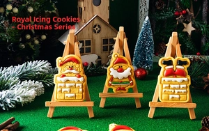 Detailed view of hand-iced Christmas Santa Claus cookies on creative display stand