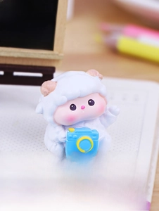 Miniature white sheep figurine with blue camera for office desk and car decor