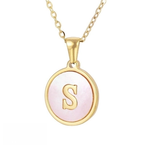 Close-up of golden necklace with pink mother-of-pearl inlay and letter S pendant