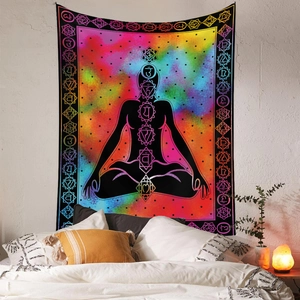Detail view of Bohemian yoga tapestry featuring seven chakras on a colorful nebula background