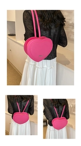 Macro detail of pink heart-shaped backpack with embossed pattern and metal zipper