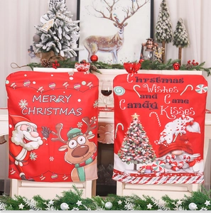 Detail of red Christmas chair covers with festive Santa, reindeer, and gnome prints