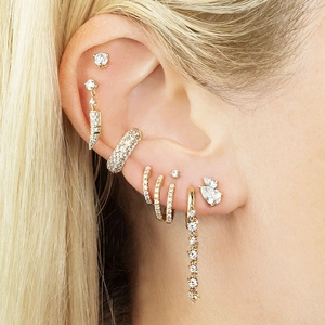 Detailed close-up of 18K gold-plated earring set featuring zircon fringes and ear cuffs