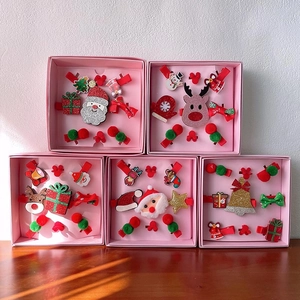 Christmas hair clip sets for girls featuring Santa, reindeer, and festive bow designs