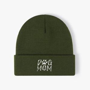 Dark green knitted beanie with white DOG MOM embroidery and paw print on white background