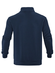 Macro view showing the waffle knit texture on the back of this navy blue sweatshirt