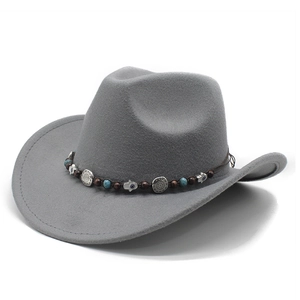 Detail of dark grey felt cowboy hat with bohemian turquoise beads and Hamsa hand charm