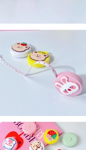 Detail of 1.5m retractable cartoon plush tape measures in multiple colors and patterns