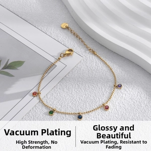 Detail of gold titanium steel bracelet with multi-color zircon stones and lobster clasp