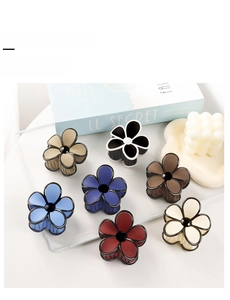 Matte flower hair claw clips in seven colors with black outline and elegant finish