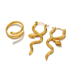 Vintage golden snake jewelry set with ring and earrings featuring detailed scales