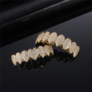 Gold plated hip hop heart shape grillz set with shiny paved crystals and reflective finish