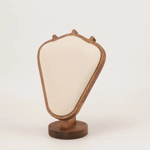 Close-up of beige velvet jewelry bust display with a solid natural wooden base stand