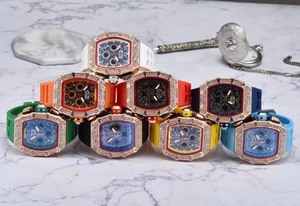 Detailed view of multi-color tonneau watches with diamond bezel and rubber straps