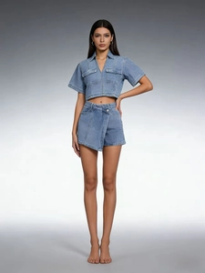 Detail of blue denim two-piece set featuring V-neck cropped top and wrap skort