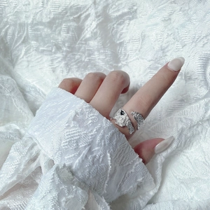 Close-up of S925 sterling silver ring with wrinkled texture worn on finger