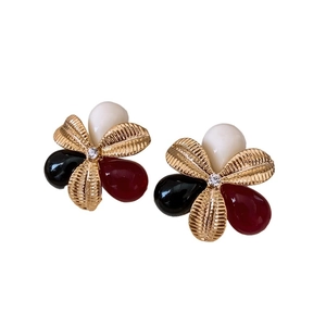 Vintage flower earrings with gold petals and resin stones in black, white, and red tones