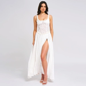 Detail of white spaghetti strap dress with corset lace bodice and high side slit