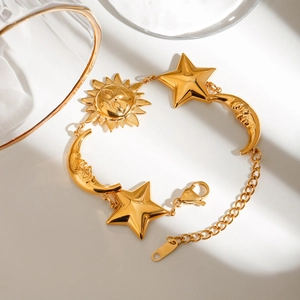 18K gold plated stainless steel bracelet featuring sun, moon, and star pendants