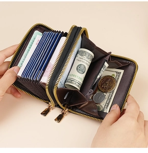 Detail view of the black leather accordion wallet showing multiple card slots and cash capacity