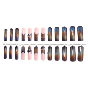 Long coffin nails with blue brown gradient and silver star accents in a 24-piece set