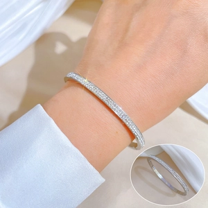 Minimalist silver titanium steel bangle with shimmering cubic zirconia pavé for women
