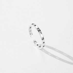 Minimalist S925 sterling silver open ring with hollow star engravings on white background