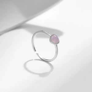 S925 silver adjustable ring featuring a soft pink heart-shaped cat-eye stone on white base