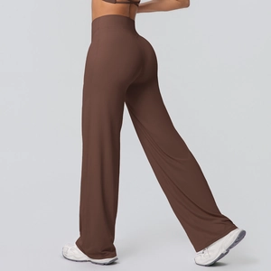 Detail of high waisted brown wide leg yoga pants showing premium drape and stretch fabric